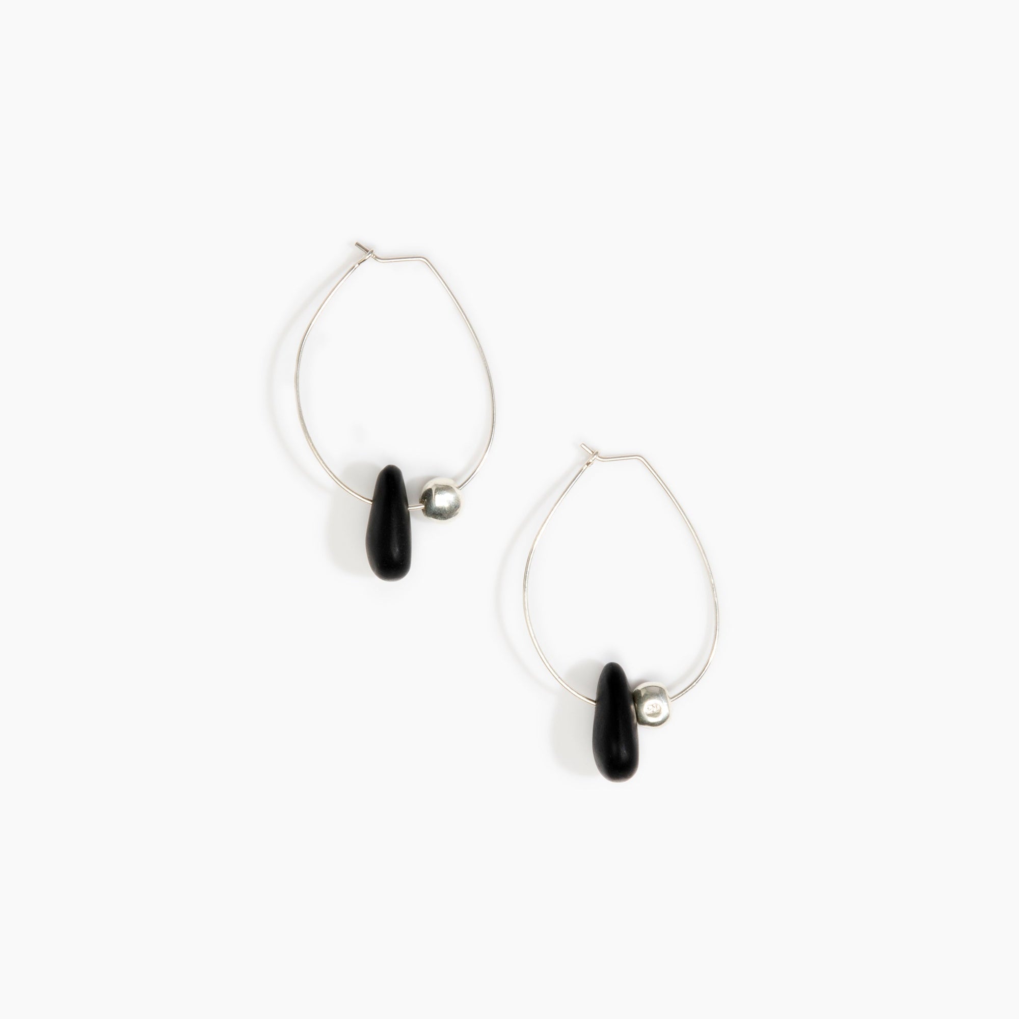Dinosaur Designs Joie De Vivre Hoop Earrings in Black Colour resin with 925 Sterling Silver Material.