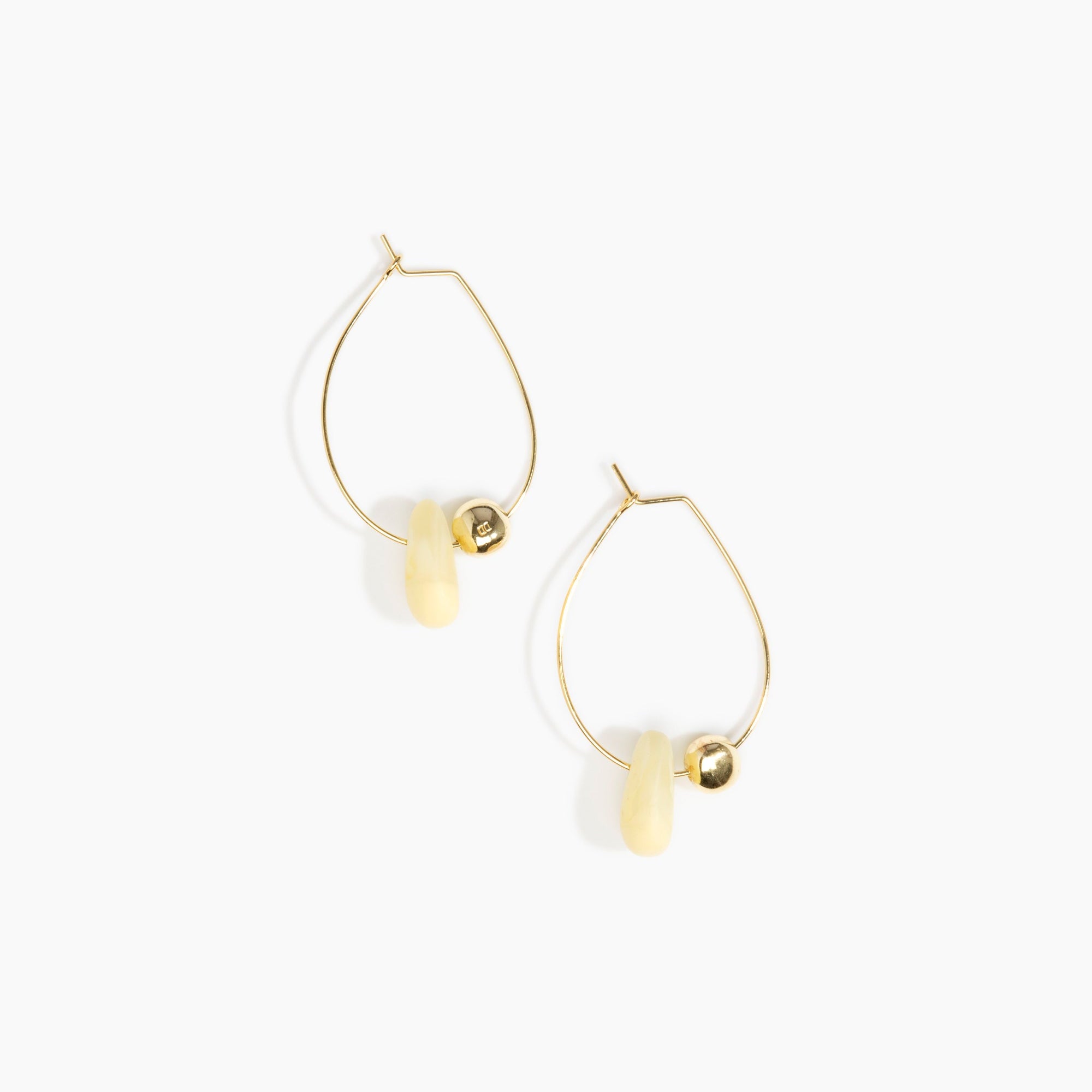 Dinosaur Designs Joie De Vivre Hoop Earrings in Lemon Colour resin with Gold-Filled Material.