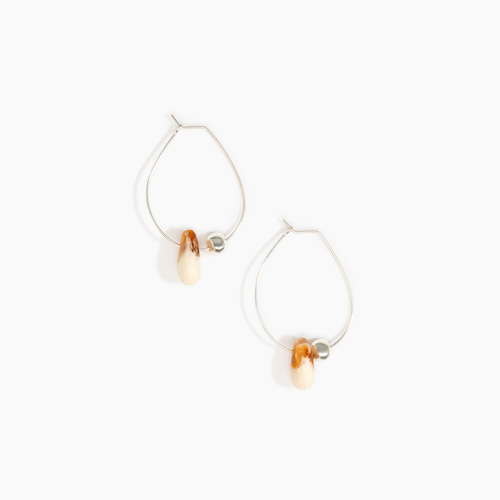 Dinosaur Designs Joie De Vivre Hoop Earrings in Light Horn Colour resin with 925 Sterling Silver Material.