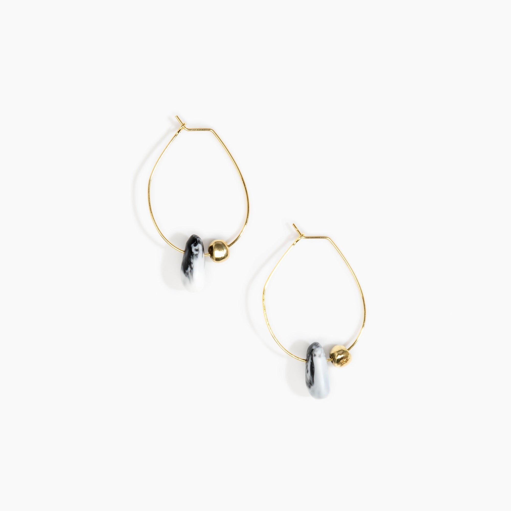 Dinosaur Designs Joie De Vivre Hoop Earrings in White Marble Colour resin with Gold-Filled Material.