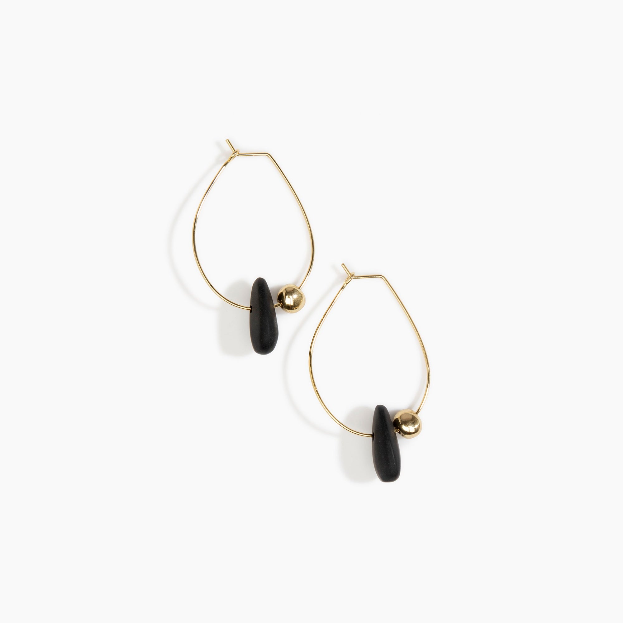 Dinosaur Designs Joie De Vivre Hoop Earrings in Black Colour resin with Gold-Filled Material.
