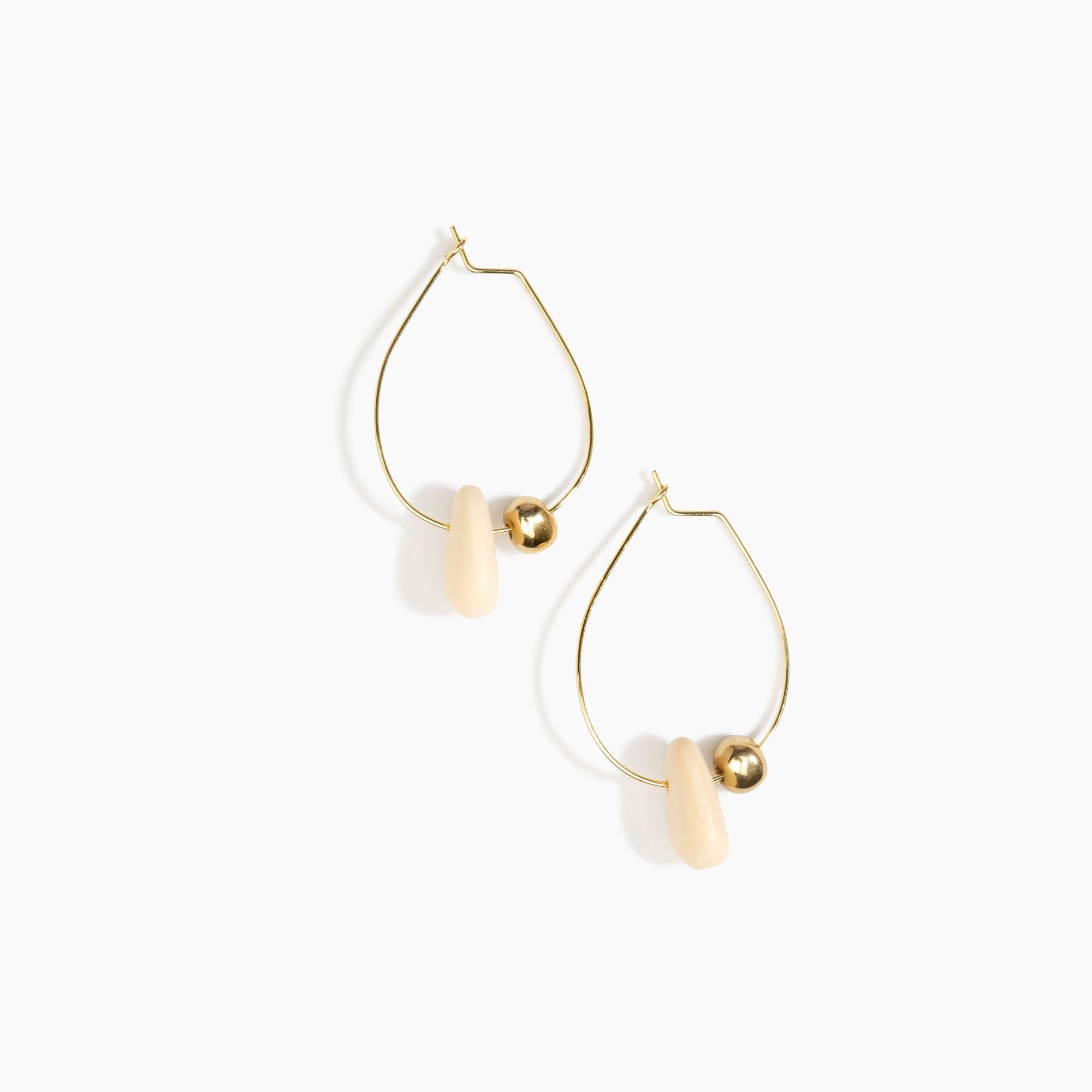 Dinosaur Designs Joie De Vivre Hoop Earrings in Cream Colour resin with Gold-Filled Material.