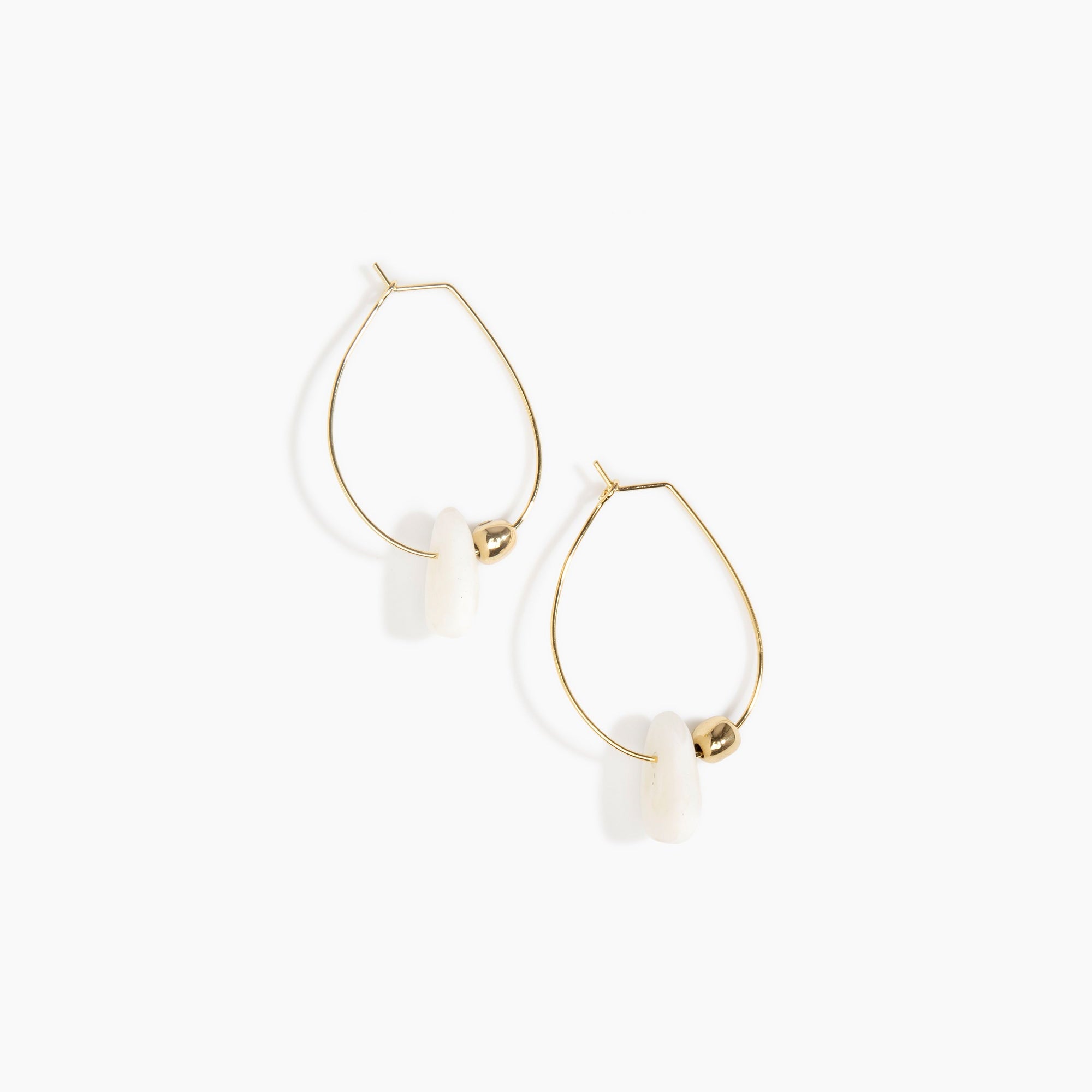 Dinosaur Designs Joie De Vivre Hoop Earrings in Snow Swirl Colour resin with Gold-Filled Material.