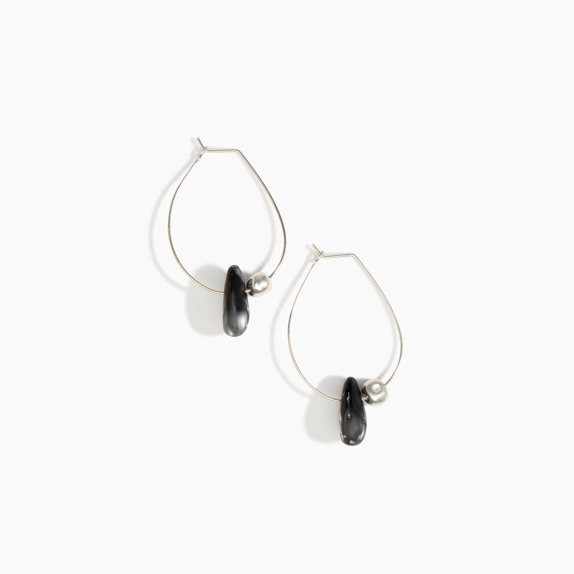 Dinosaur Designs Joie De Vivre Hoop Earrings in Black Marble Colour resin with 925 Sterling Silver Material.