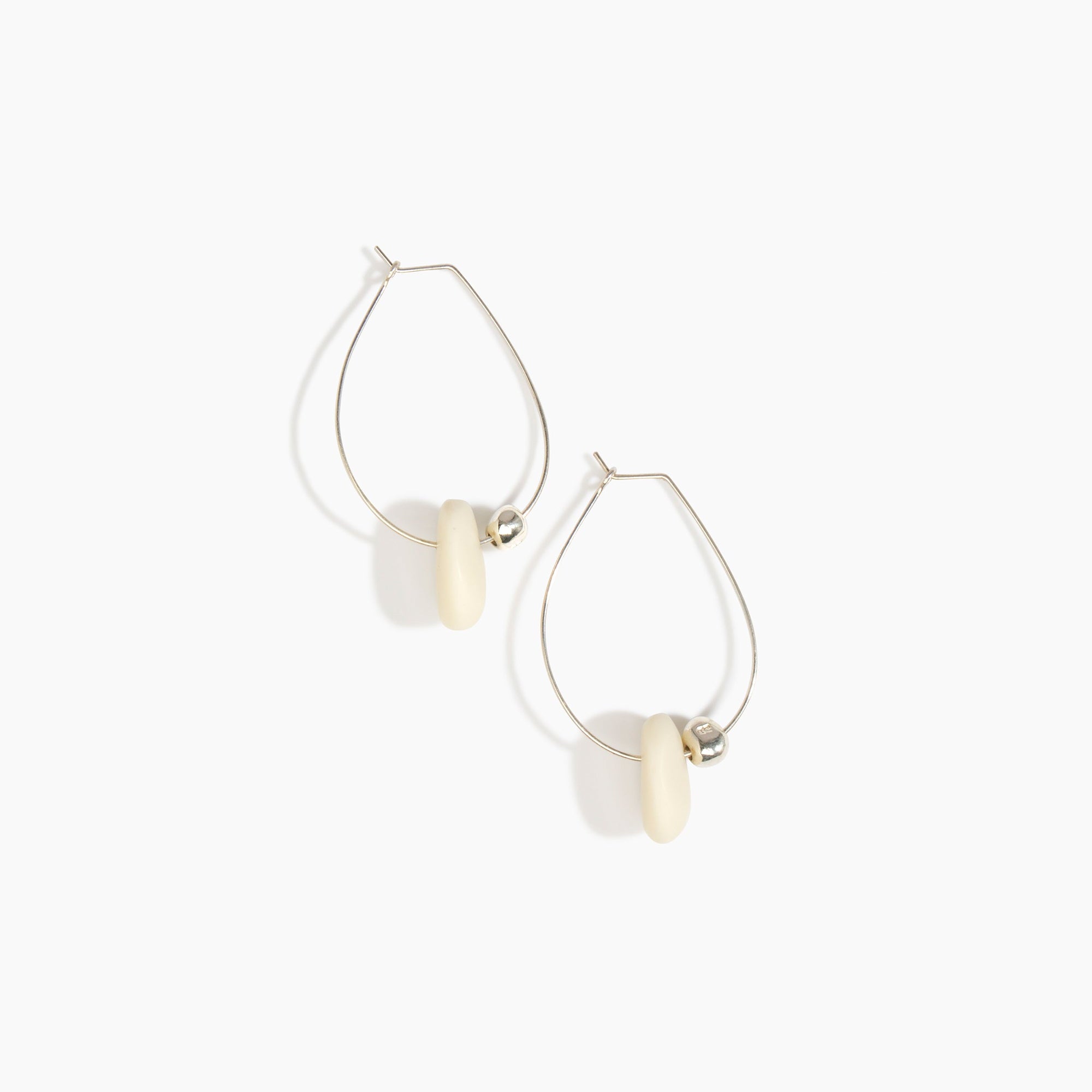 Dinosaur Designs Joie De Vivre Hoop Earrings in Cream Colour resin with 925 Sterling Silver Material.