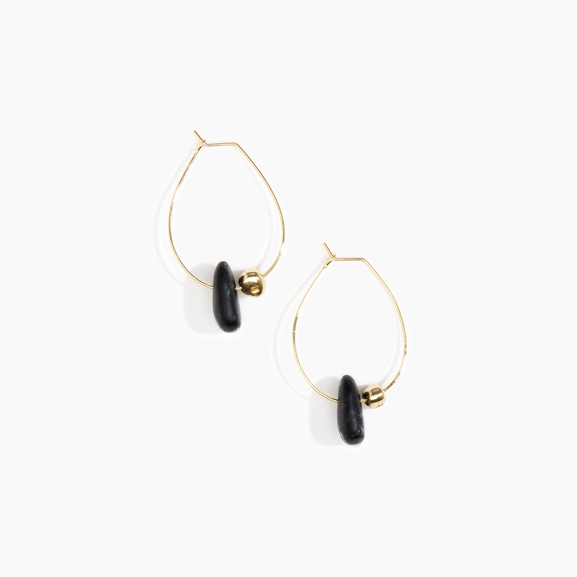 Dinosaur Designs Joie De Vivre Hoop Earrings in Black Marble Colour resin with Gold-Filled Material.