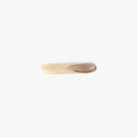 Dinosaur Designs Stone Butter Knife in Sandy Pearl Colour resin..