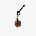 Dinosaur Designs Flat Watercolour Bag Charm in Dark Horn Colour resin with Brass Material.