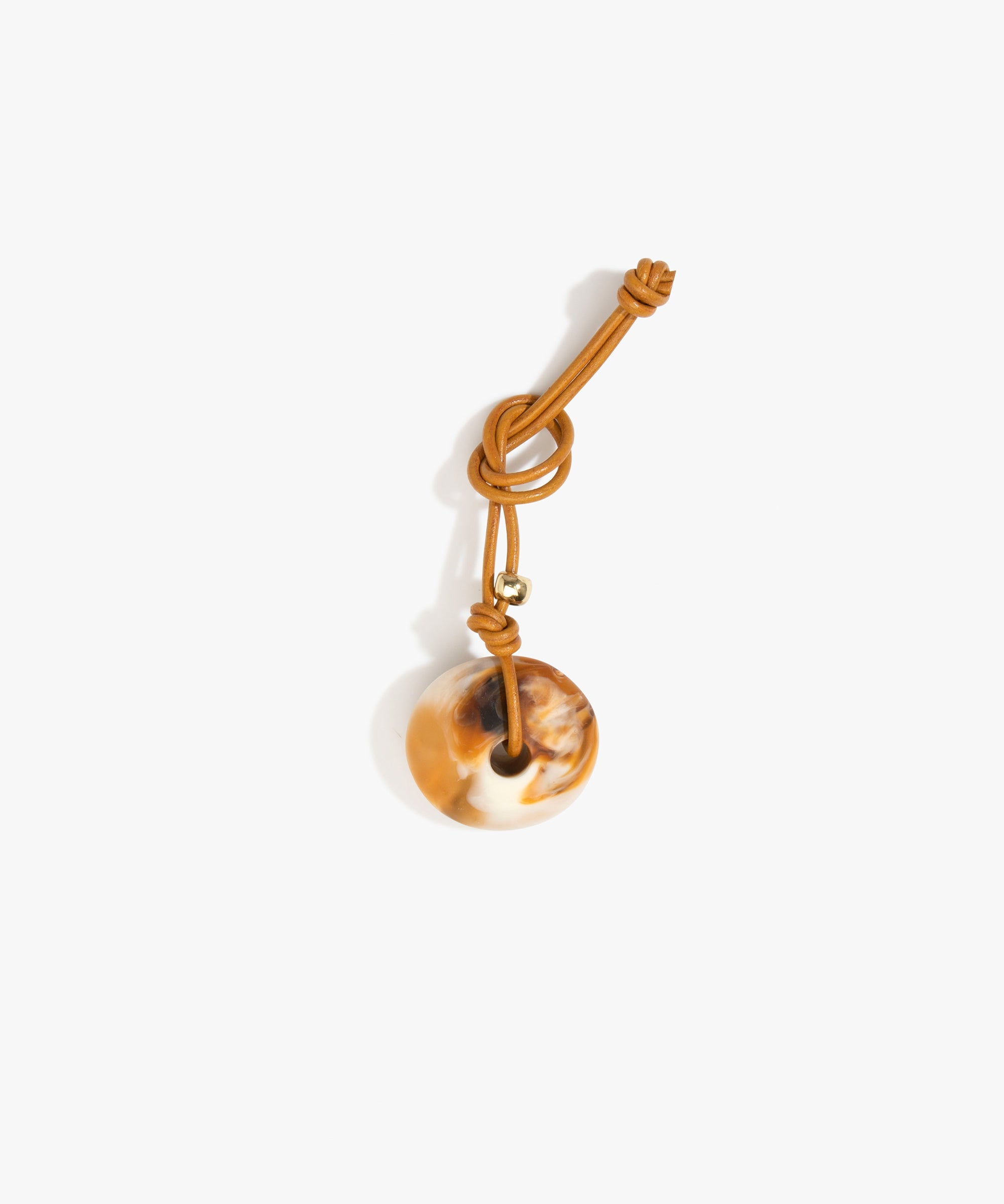Dinosaur Designs Flat Watercolour Bag Charm in Light Horn Colour resin with Brass Material..