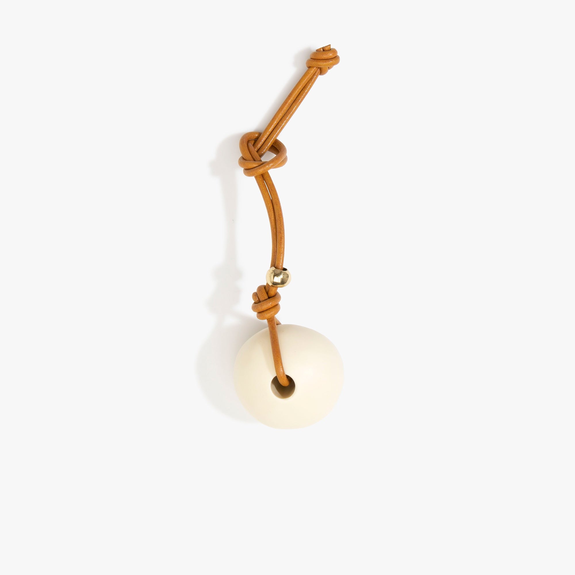 Dinosaur Designs Round Watercolour Bag Charm in Cream Colour resin with Brass Material..