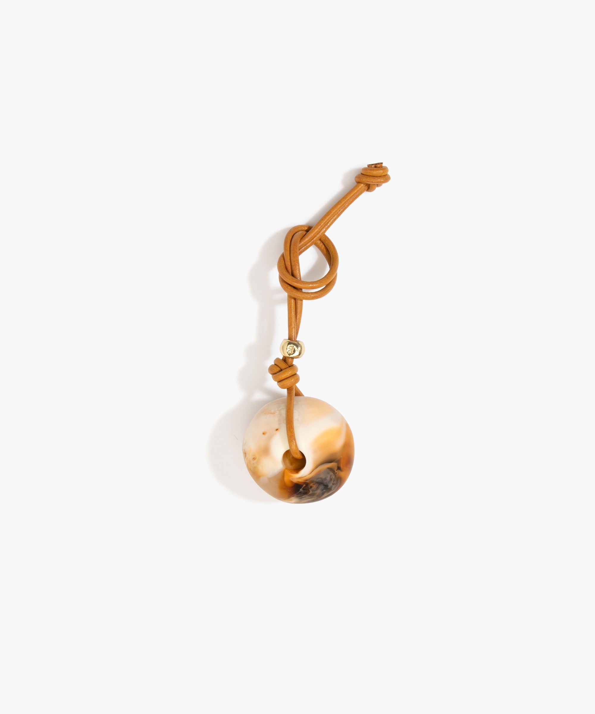 Dinosaur Designs Round Watercolour Bag Charm in Light Horn Colour resin with Brass Material...