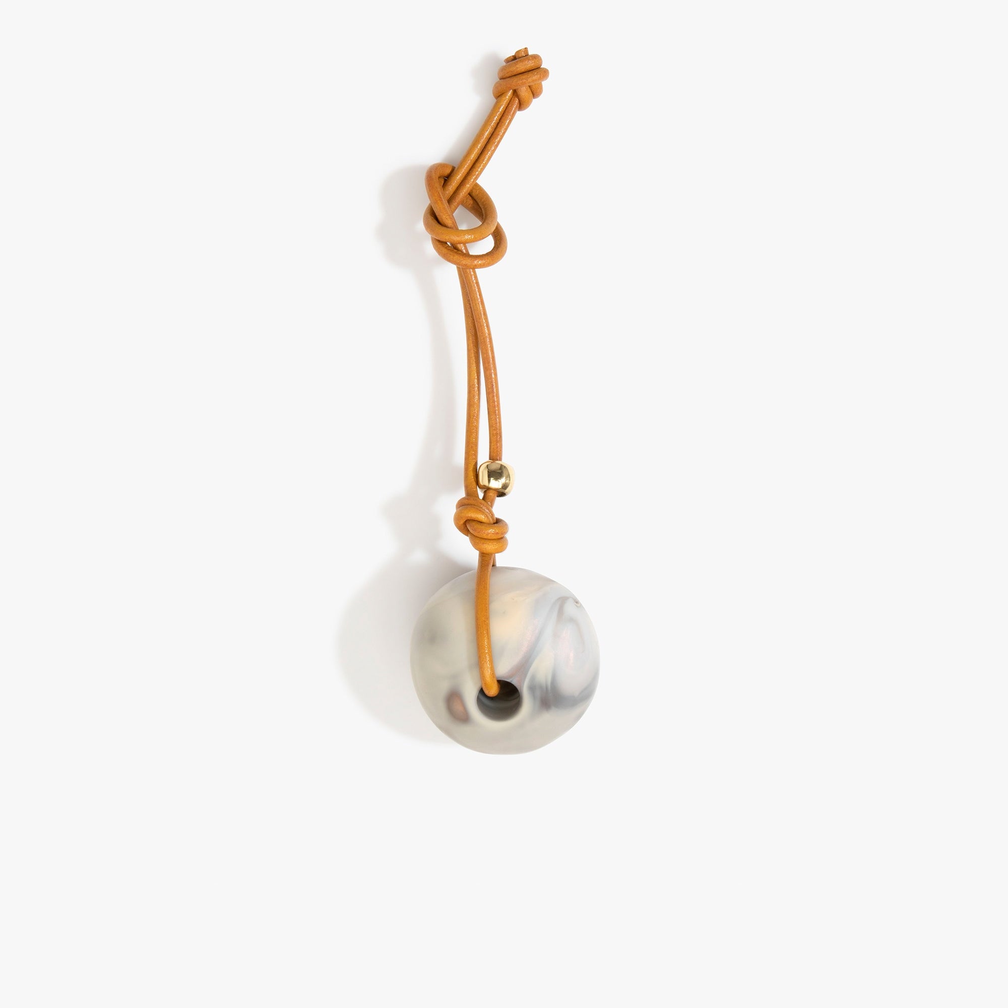 Dinosaur Designs Round Watercolour Bag Charm in Sandy Pearl Colour resin with Brass Material..